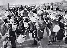 South Korean refugees fleeing during the early months of the Korean War. The war provided part of the impetus for termination of the Occupation, both because of the need for American troops on the peninsula and because Allied procurement contracts with Japan revitalized the Japanese economy.