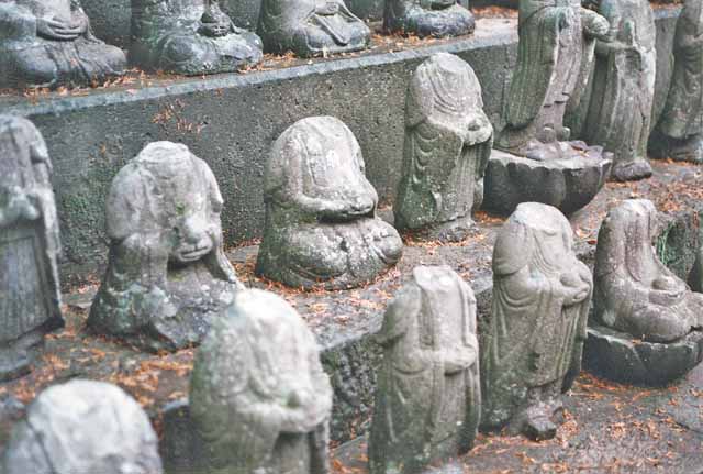 Statues of the Buddhist bodhhisatva Jizo from the ruins of Hara Castle. The heads of each statue were removed by rebelling Christians during the Shimabara Rebellion.