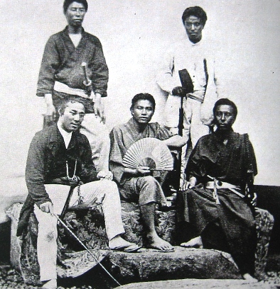 The officers of the Satsuma cruiser Haruhi, taken in 1869. Togo Heihachiro is in the upper right corner wearing white.