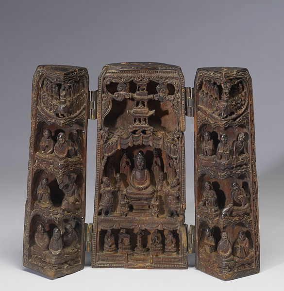 A portable shrine from China; the image depicted is Sakyamuni Buddha (the Budda) preaching the Lotus Sutra before his death. Courtesy of the Wikimedia Foundation.