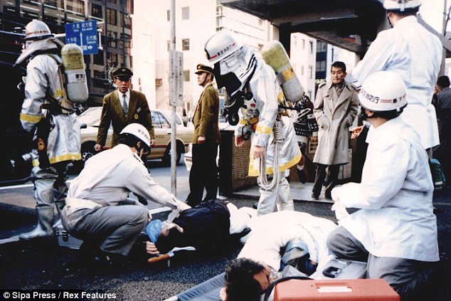 Japanese responders removing sarin residue after the attacks. Courtesy of Asahi Shinbun.
